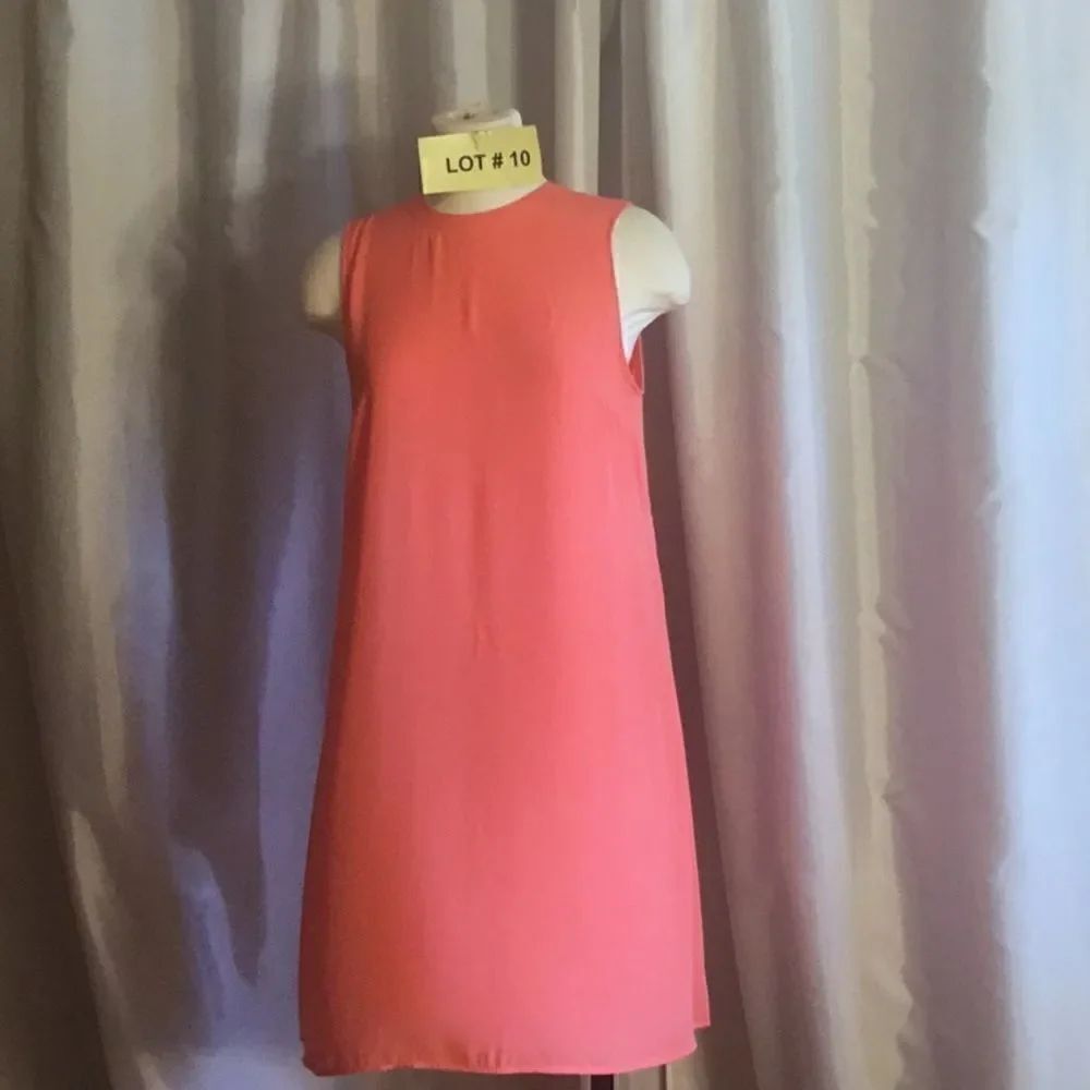 Sleeveless light tangerine dress in medium with back pleats